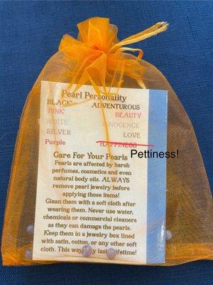 Purple pearl symbolizes happiness? No, actually pettiness.