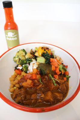 Small bowl with jerk pork and vegetables