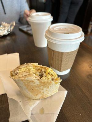 Breakfast burrito with sausage and two lattes