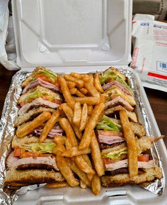 Club sandwich and fries