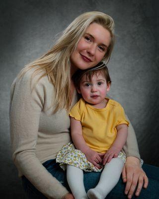 Portrait of young mother with baby daughter.