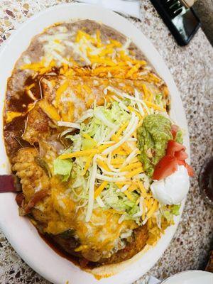 3 item specialty plate. Shredded beef burrito, chile Reyano, a taco under the mound of lettuce, sour cream and guacamole . Delicious
