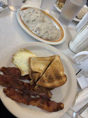 Bacon perfectly crisp. Eggs over medium and toast and biscuits and gravy!