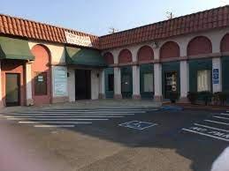 Corner of 14tth and H. One block west of Library.
Turn into parking lot where you see 802.