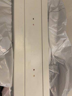 Spackled over cabinet holes on cabinets that we were sold as new custom!