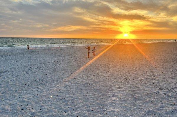 Beach DIRECTLY in front of Condos. LITERALLY Steps from the pool/rooms. On cloudless evenings - Sunsets are 10/10