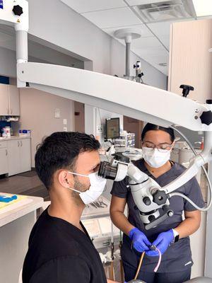 Dr. Ali Adil treating patients chairside.