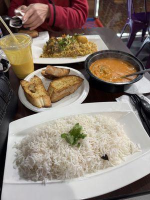 Butter chicken, garlic bread, Chicken Biryani, and mango lassi. Everything tasted very good. Highly recommend the chicken biryani!
