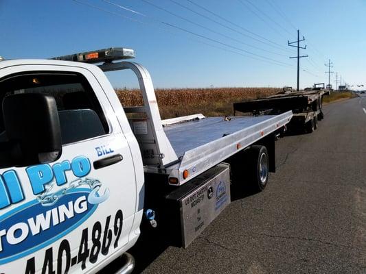 Hauling broken equipment trailers for a stranded account.