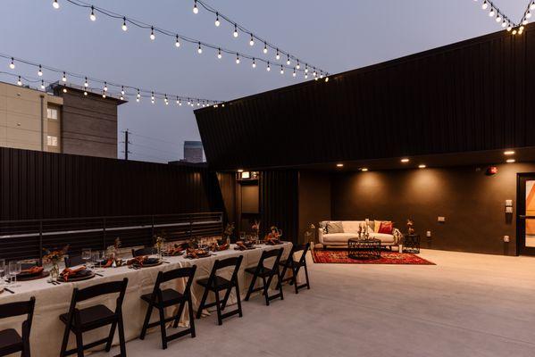 Rooftop dinner setup under the stars