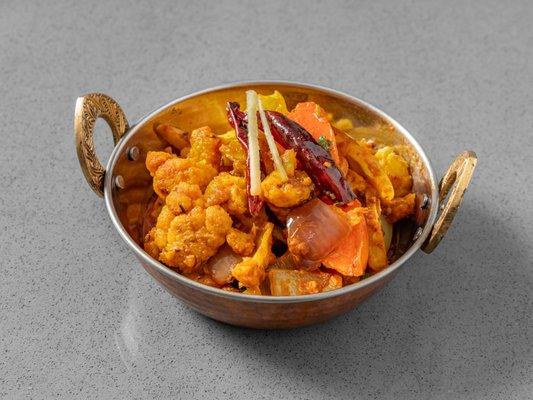 Stir fry cauliflower peas, turmeric, Indian spices.