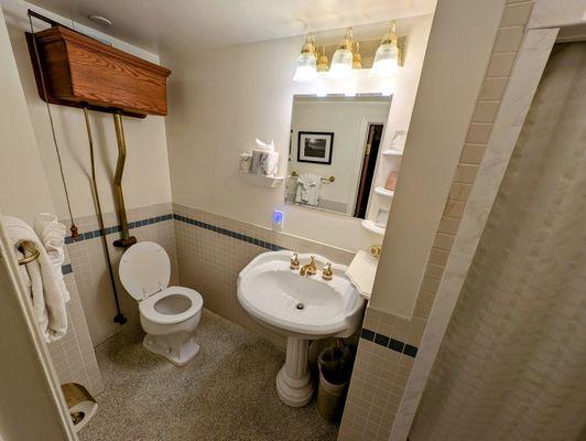 Room 439 bathroom with delightful brass and tile highlights
