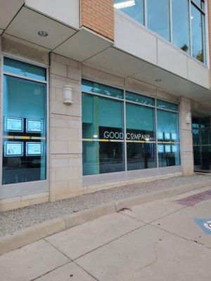 Front of building. Is on a side street. Next to the railroad tracks. Faces Buffalo Wild Wings