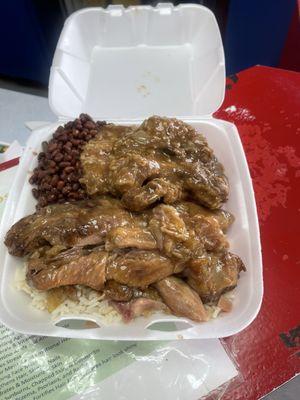 Smothered chops, Turkey wings, light scoop of rice and double field peas. In the name of Jesus!!