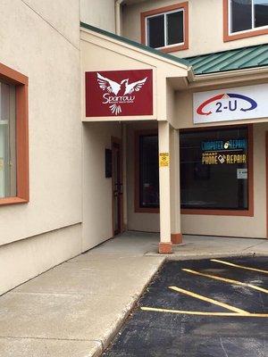 Signage from the front of the building (located within the Exeter Plaza).