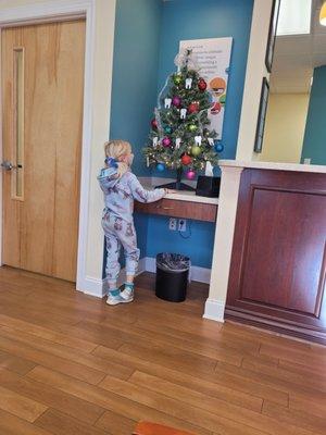 F admiring the tooth ornaments.