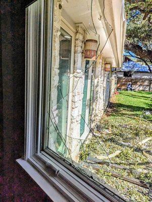 our lovely broken window that has been boarded up for over a month now just waiting for Pella.....