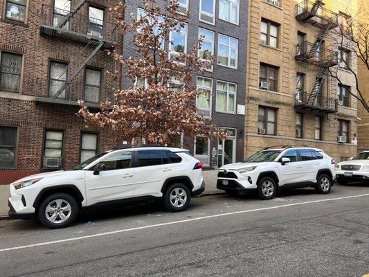 My mom and my matching white 2021 Toyota RAV4 XLE and LE! Aside from small details, I could hardly tell the difference!