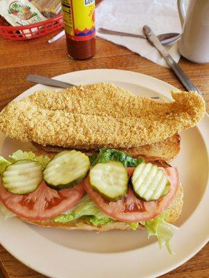 Catfish sandwich. Not just fried cornmeal. But, seasoned right cornmeal.