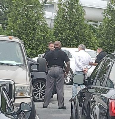 Tim being arrested at a club which he is no longer a member. I personally assisted the Police by blocking his car. It's my new screensaver.