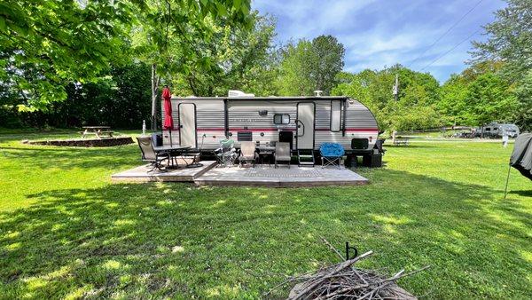 Many of our sites come with a wood deck already in place. And all of our sites are oversized. Look at the huge yard around this site!