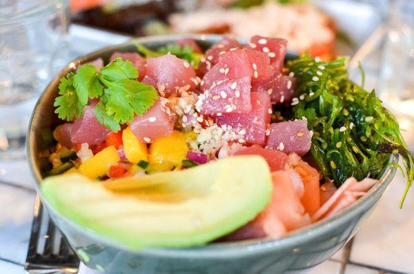 Ahí tuna poke bowl with great ingredients like brown rice, avo, ginger, mango etc etc