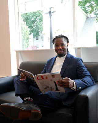 Reading our luxury lifestyle magazine, GG, in the office.