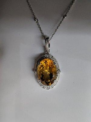 White Gold Estate piece Oval Citrine stone on 10k Filigree mounting. with a Diamond chain.