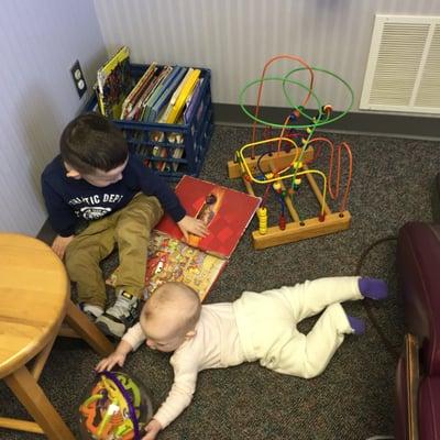 milk crate of books, and toys