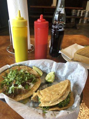 Two tacos, tamale and coke