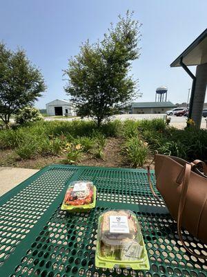 Outdoor seating area - small Tasty Turkey sandwich and chicken salad scoop.