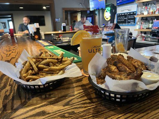 Old Bay chicken wings, fries and an ice cold Blue Moon