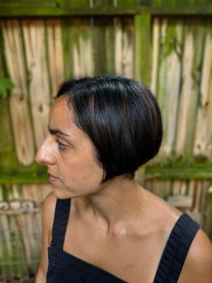 Grey blending color and a pixie bob haircut