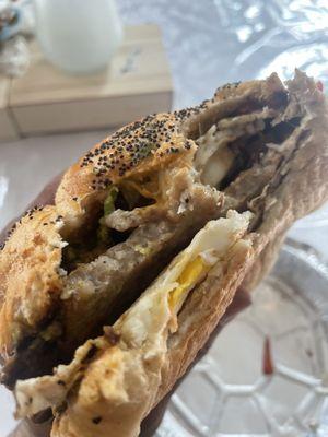 Breakfast Torta- sausage, egg, cheese, black beans, red peppers, avacado, chipotle mayo on toasted oversized roll