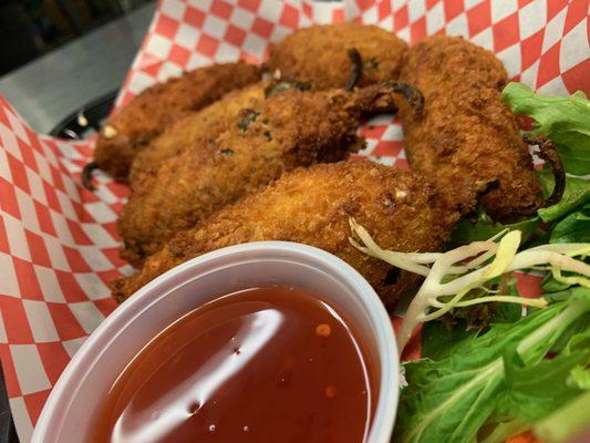 "Jalapeno Poppers" jalapenos lightly breaded and stuffed with cream cheese and spices