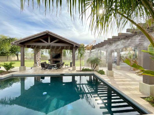 Cooling misting system by the pool.