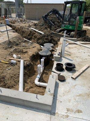 Installing oil/water separator and new sanitary service to commercial building