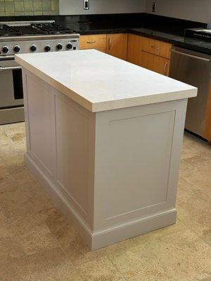 Our kitchen island. Previously it was an old butcher block on top; Premier Granite cut and installed the quartz from just the measurements.