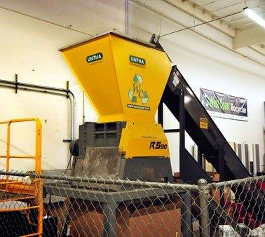 Industrial shredder, which completely obliterates hard drives and other media turning them into scrap metal.