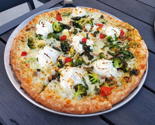 Penny Lane pesto, crumbled sausage, broccoli, sweet drop peppers, mozzarella, feta, ricotta, basil