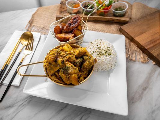 Curried Chicken served with white rice and
Plaintains