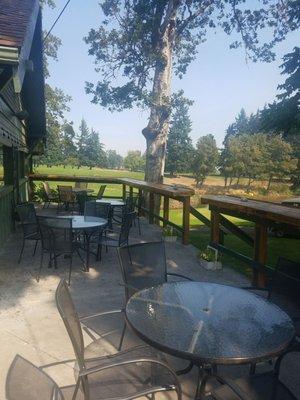 Shady patio overlooking golf course.