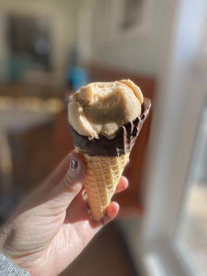 Almond chai vegan ice cream with chocolate dipped waffle cone