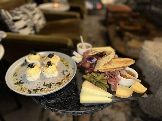 Caviar deviled eggs and small charcuterie board