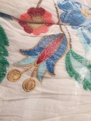 Not hand embroidered. Cheap machine embroidered. Colors and fabric different than pitcured online.