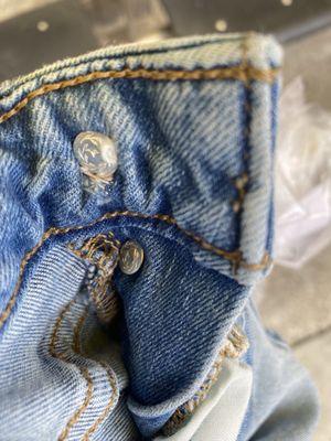 Loose button, that wasn't replaced as asked