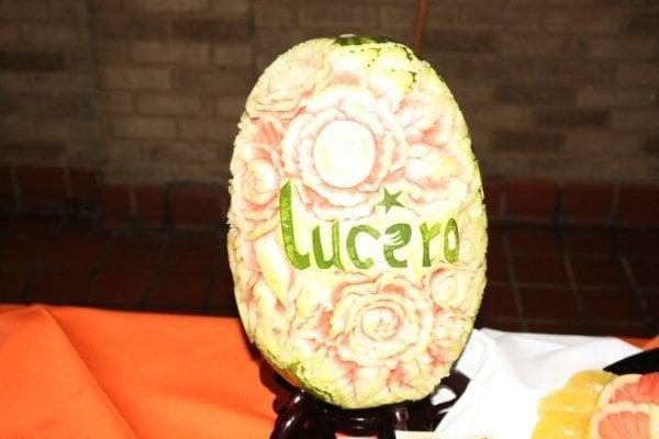 Lucero's logo carved in a melon