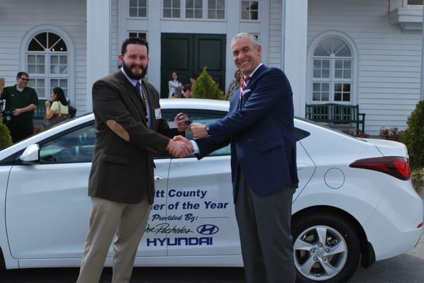 Pitt County's Teacher of the Year, Matthew Robinson, receiving the keys to his brand new Hyundai Elantra that is his for the year.