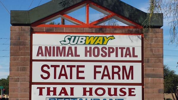 The sign for superstition animal hospital located on the south side of the property.