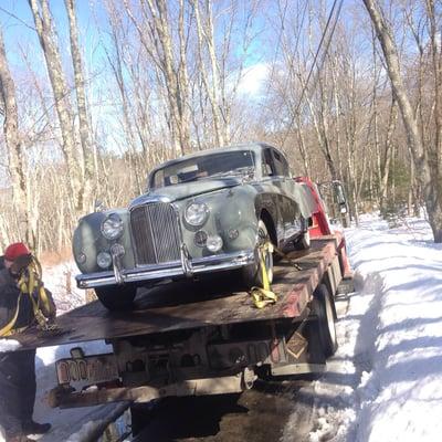 Don carefully strapping down my vintage Jaguar!